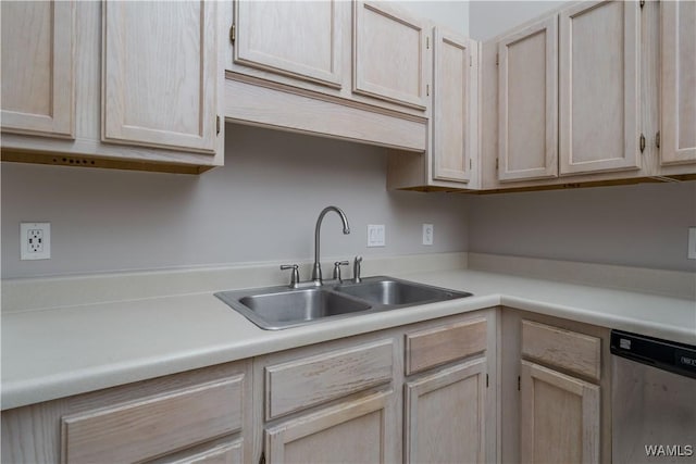 kitchen featuring sink, dishwasher, and light brown cabinets