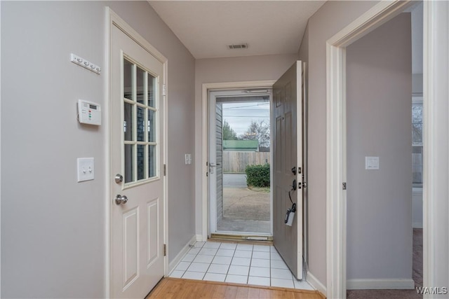 entryway with light hardwood / wood-style floors