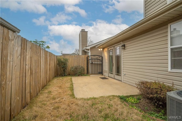 view of yard featuring a patio area and central air condition unit