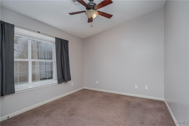 empty room featuring carpet floors and ceiling fan