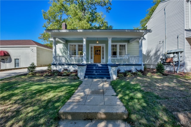 bungalow-style home featuring a front lawn