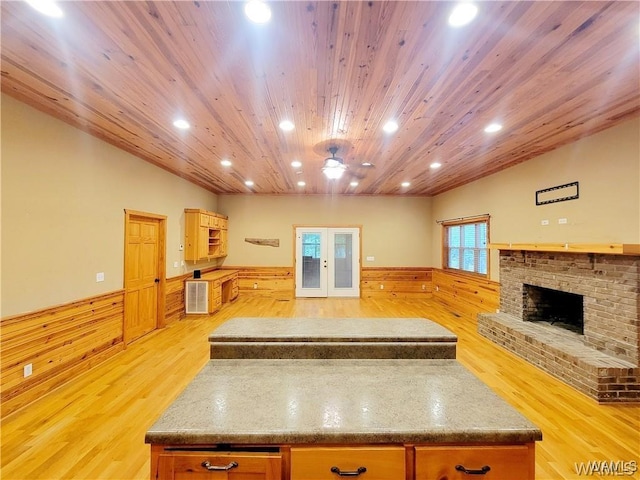 kitchen featuring recessed lighting, french doors, wooden ceiling, and a kitchen island