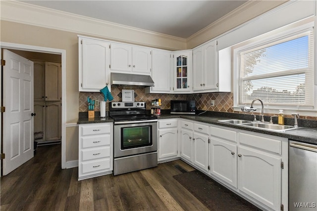 kitchen with dark wood-type flooring, ventilation hood, white cabinets, sink, and stainless steel appliances