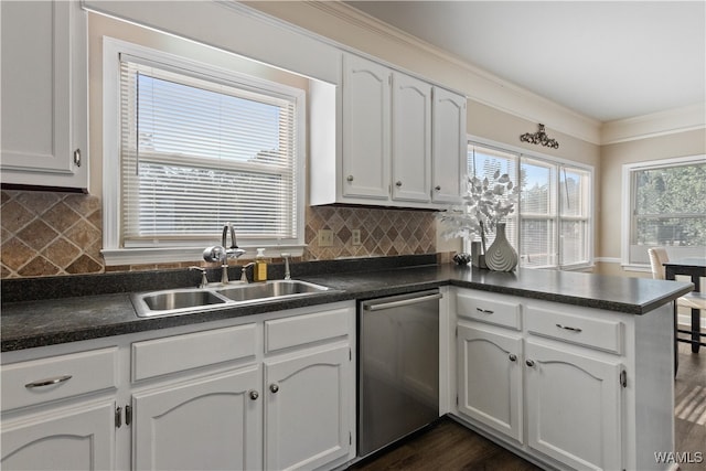 kitchen with stainless steel dishwasher, white cabinetry, and sink