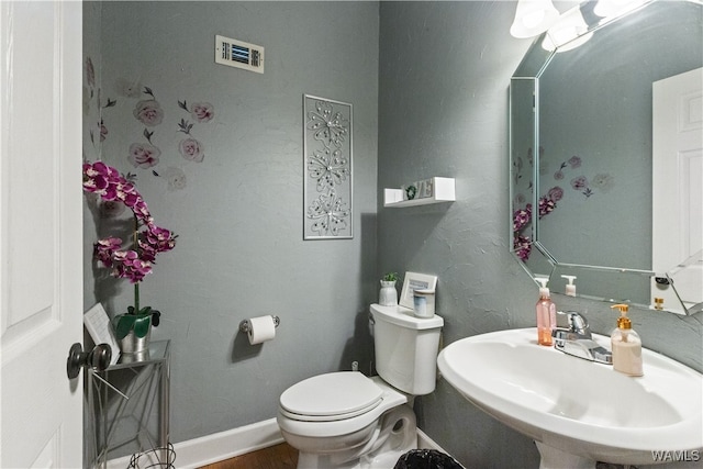 bathroom with sink and toilet