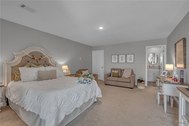 13930 Sullivan Blvd, Northport, AL 35475 - bedroom featuring light colored carpet, ensuite bath, visible vents, and recessed lighting