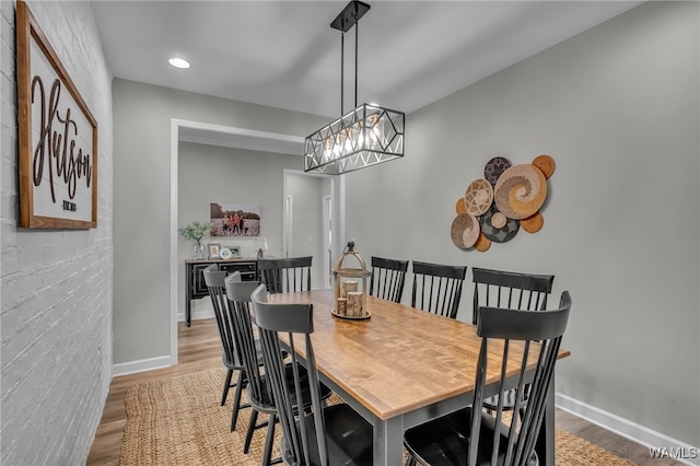 13930 Sullivan Blvd, Northport, AL 35475 - dining space with recessed lighting, baseboards, an inviting chandelier, and wood finished floors
