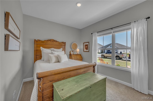 13930 Sullivan Blvd, Northport, AL 35475 - bedroom with carpet flooring, baseboards, and multiple windows