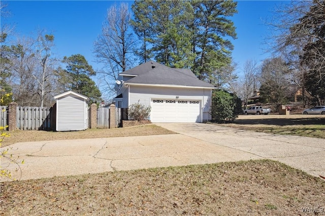 view of property exterior featuring a garage, fence, and concrete driveway