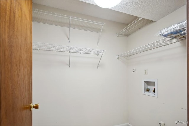 clothes washing area featuring laundry area and washer hookup