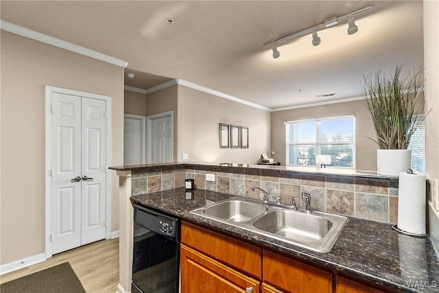 kitchen featuring decorative backsplash, brown cabinetry, dishwasher, light wood-style flooring, and a sink