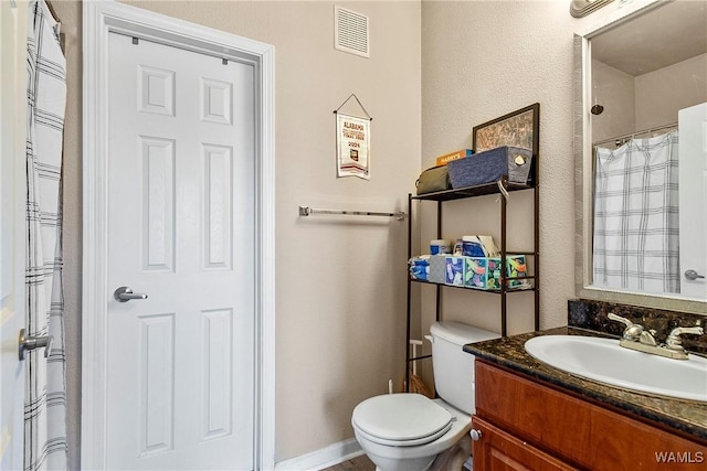 full bathroom featuring baseboards, visible vents, vanity, and toilet