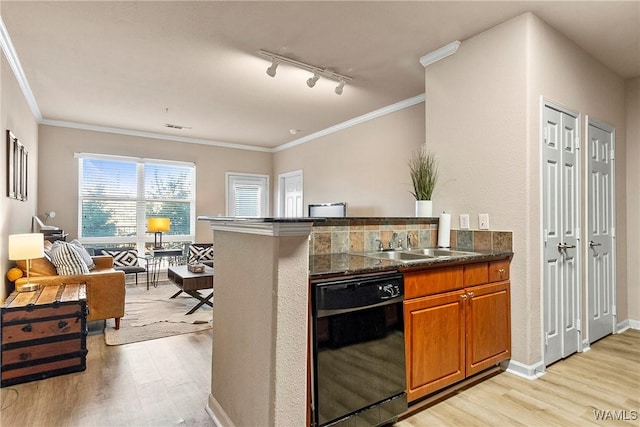 kitchen featuring light wood finished floors, black dishwasher, brown cabinets, and a sink