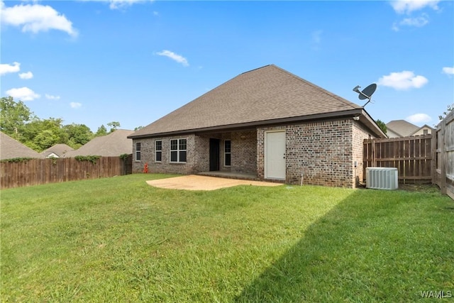 11542 Woodford St, Northport, AL 35475 - rear view of house with a patio, brick siding, and a shingled roof