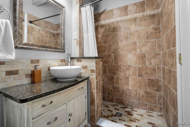 4901 Oak Way, Northport, AL 35473 - full bathroom featuring vanity, backsplash, and a stall shower
