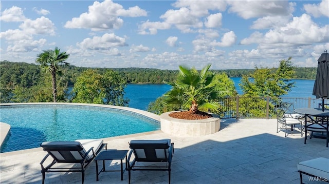 1231 Diamond Point Cir, Tuscaloosa, AL 35406 - outdoor pool featuring a wooded view, a patio area, and a water view