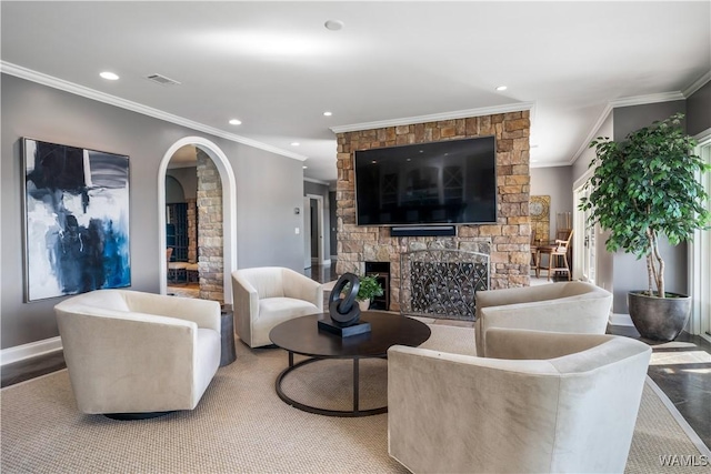 1231 Diamond Point Cir, Tuscaloosa, AL 35406 - living area with visible vents, recessed lighting, arched walkways, a stone fireplace, and crown molding