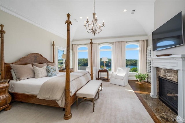 1231 Diamond Point Cir, Tuscaloosa, AL 35406 - bedroom with an inviting chandelier, crown molding, visible vents, and a premium fireplace