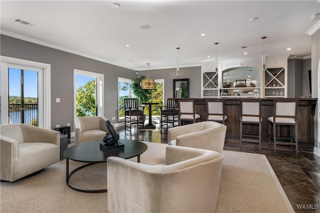1231 Diamond Point Cir, Tuscaloosa, AL 35406 - living room featuring visible vents, baseboards, recessed lighting, crown molding, and a dry bar
