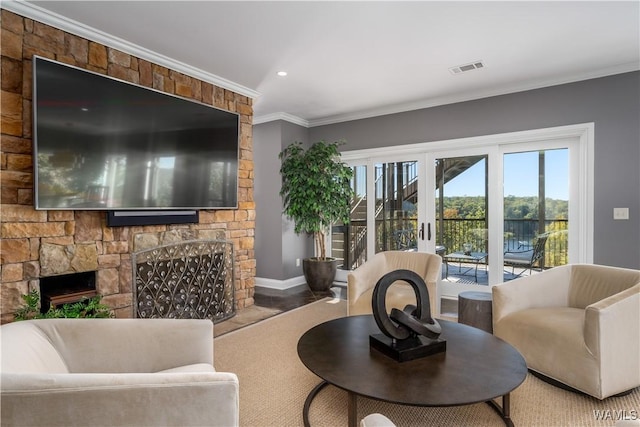 1231 Diamond Point Cir, Tuscaloosa, AL 35406 - living room with visible vents, baseboards, ornamental molding, a stone fireplace, and french doors