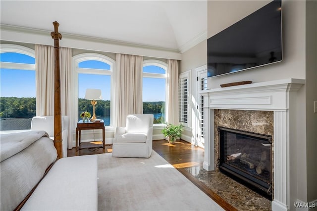 1231 Diamond Point Cir, Tuscaloosa, AL 35406 - living room featuring a healthy amount of sunlight, wood finished floors, ornamental molding, and a premium fireplace