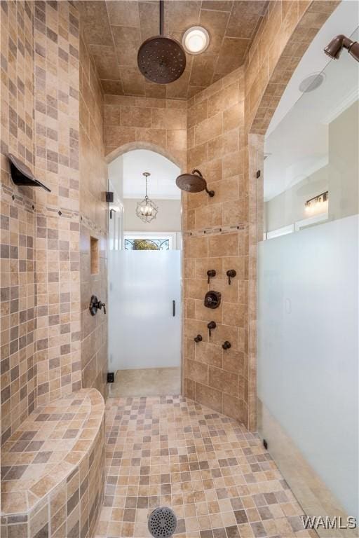1231 Diamond Point Cir, Tuscaloosa, AL 35406 - bathroom featuring a notable chandelier and tiled shower