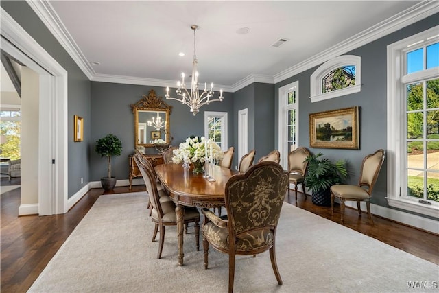 1231 Diamond Point Cir, Tuscaloosa, AL 35406 - dining space featuring visible vents, plenty of natural light, an inviting chandelier, and wood finished floors