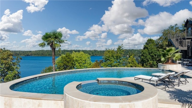 1231 Diamond Point Cir, Tuscaloosa, AL 35406 - view of pool featuring a patio area, a pool with connected hot tub, and a water view