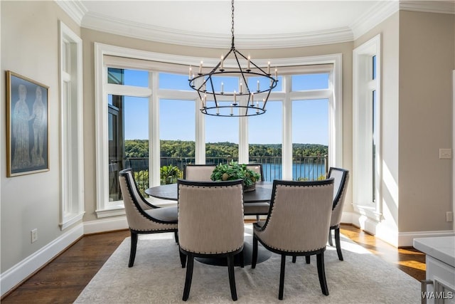 1231 Diamond Point Cir, Tuscaloosa, AL 35406 - dining room with a chandelier, dark wood-style floors, baseboards, and ornamental molding