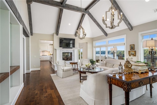 1231 Diamond Point Cir, Tuscaloosa, AL 35406 - living room featuring a fireplace, visible vents, a wealth of natural light, and a chandelier