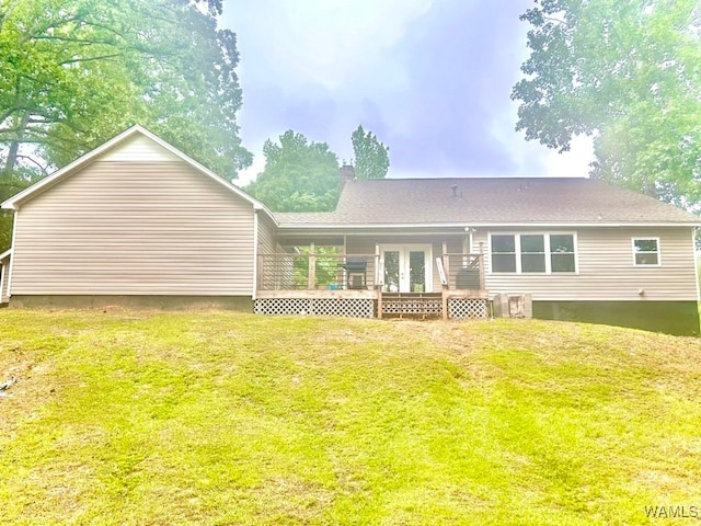 5211 Briarcliff Dr, Northport, AL 35473 - back of property with a wooden deck, a lawn, french doors, a chimney, and a shingled roof