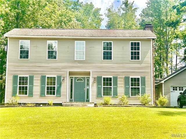 5211 Briarcliff Dr, Northport, AL 35473 - colonial house with a chimney, a front lawn, and a garage