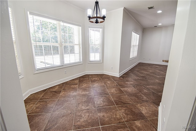 unfurnished dining area with crown molding and a notable chandelier