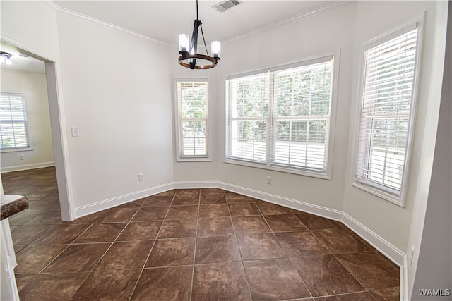 unfurnished dining area featuring crown molding, a healthy amount of sunlight, and a notable chandelier