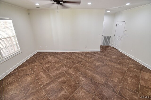 unfurnished room with ceiling fan and ornamental molding