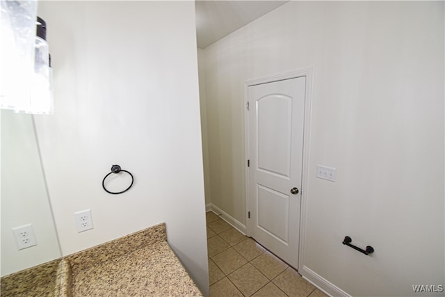 bathroom with tile patterned floors