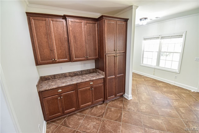 kitchen featuring crown molding