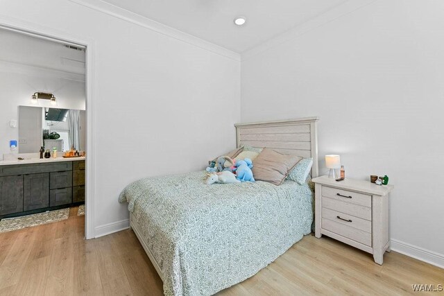 800 Red Drew Ave, Tuscaloosa, AL 35401 - bedroom featuring wood finished floors, ornamental molding, and ensuite bath