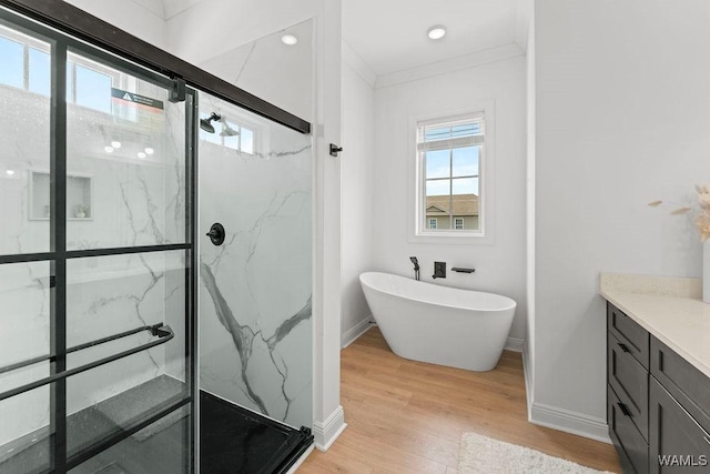 800 Red Drew Ave, Tuscaloosa, AL 35401 - full bathroom with a marble finish shower, wood finished floors, a freestanding tub, and vanity