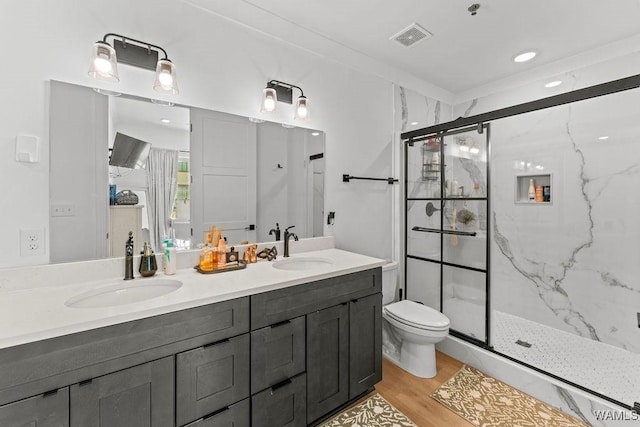 800 Red Drew Ave, Tuscaloosa, AL 35401 - full bathroom featuring double vanity, a marble finish shower, and wood finished floors