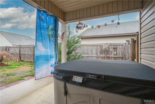 view of patio with a hot tub