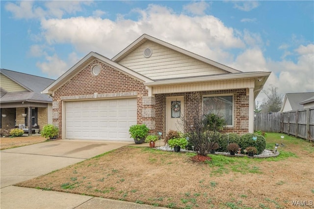 view of front of property featuring a garage and a front yard