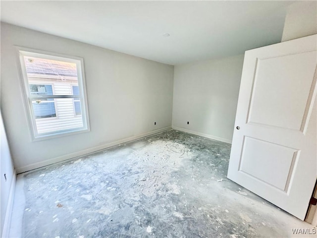 unfurnished bedroom featuring baseboards