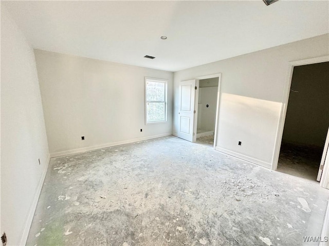 unfurnished bedroom with visible vents and baseboards