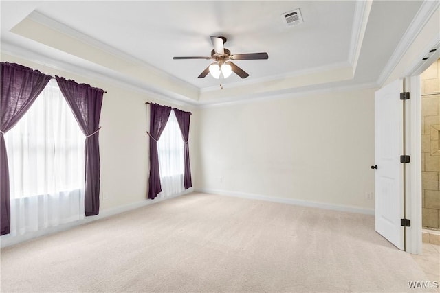 9437 Crete Cir, Tuscaloosa, AL 35406 - empty room with a tray ceiling, crown molding, ceiling fan, and light colored carpet