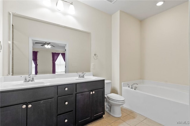 9437 Crete Cir, Tuscaloosa, AL 35406 - full bath featuring tile patterned flooring, double vanity, a garden tub, and a ceiling fan