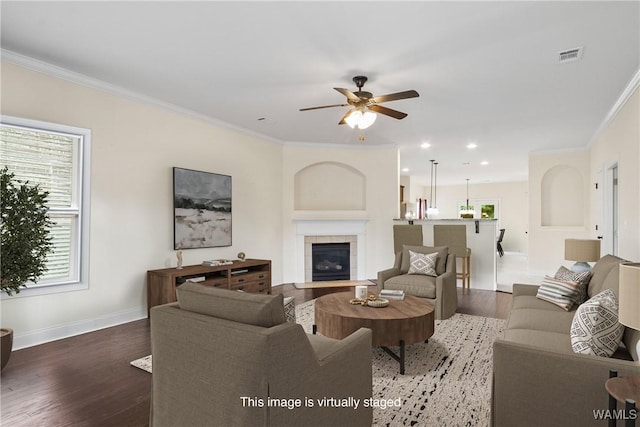 9437 Crete Cir, Tuscaloosa, AL 35406 - living area with a ceiling fan, crown molding, wood finished floors, recessed lighting, and a tiled fireplace