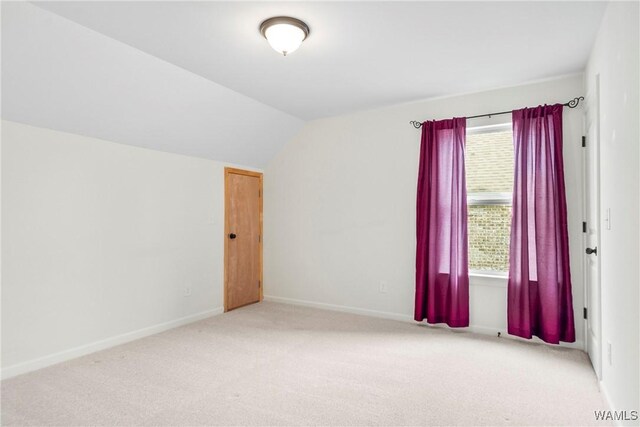 9437 Crete Cir, Tuscaloosa, AL 35406 - spare room featuring light colored carpet and lofted ceiling