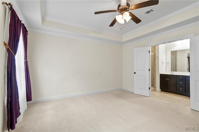 9437 Crete Cir, Tuscaloosa, AL 35406 - unfurnished bedroom with light colored carpet, crown molding, a tray ceiling, connected bathroom, and ceiling fan