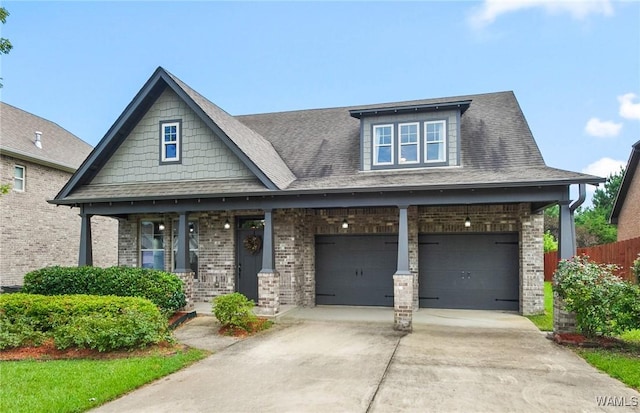 9437 Crete Cir, Tuscaloosa, AL 35406 - craftsman inspired home with driveway, brick siding, an attached garage, and a porch